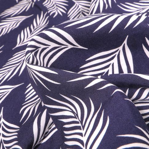 Tissu Viscose Popeline Feuilles de palme blanches sur fond Bleu marine