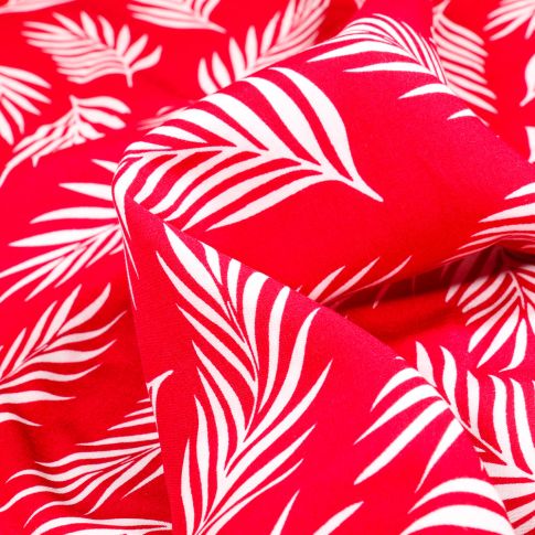 Tissu Viscose Popeline Feuilles de palme blanches sur fond Rouge