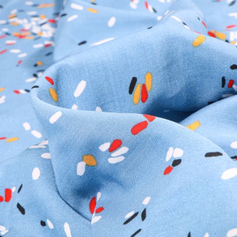 Tissu Viscose Popeline Confettis multicolores sur fond Bleu ciel