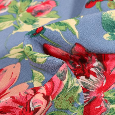 Tissu Crêpe stretch Pivoines colorées sur fond Bleu