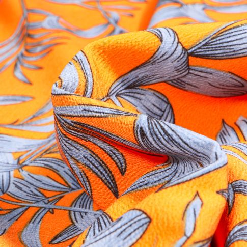 Tissu Crêpe Carmen sur fond Orange