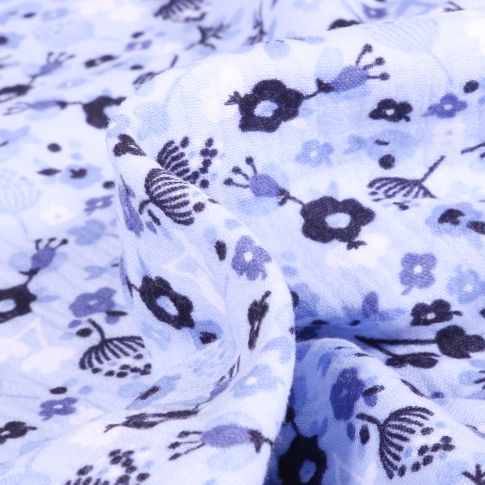 Tissu Double gaze imprimé Fleuris sur fond Bleu ciel