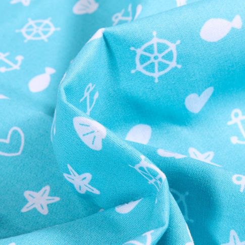 Tissu Coton imprimé Motifs marins et coeurs sur fond Bleu turquoise