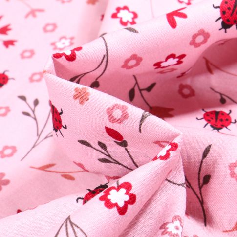 Tissu Coton imprimé Ladybug Coccinelle et fleurs sur fond Rose