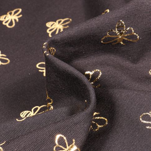 Tissu Jersey Coton Abeilles métallisées dorées sur fond Noir