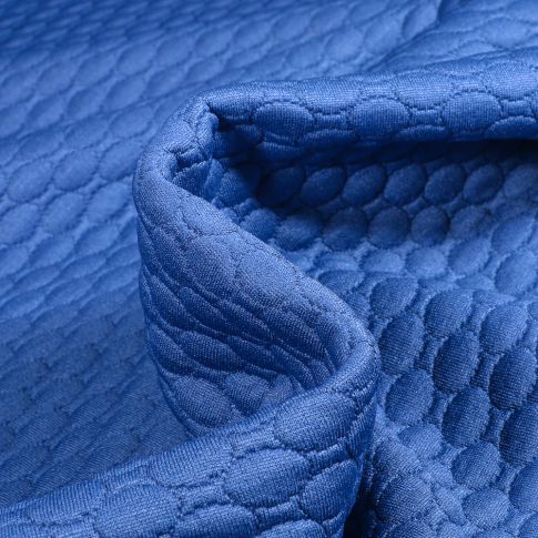 Tissu Sweat matelassé Alvéoles ovales sur fond Bleu roi