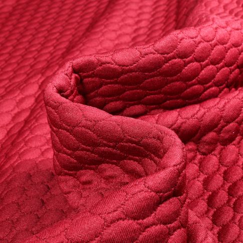 Tissu Sweat matelassé Alvéoles ovales sur fond Framboise