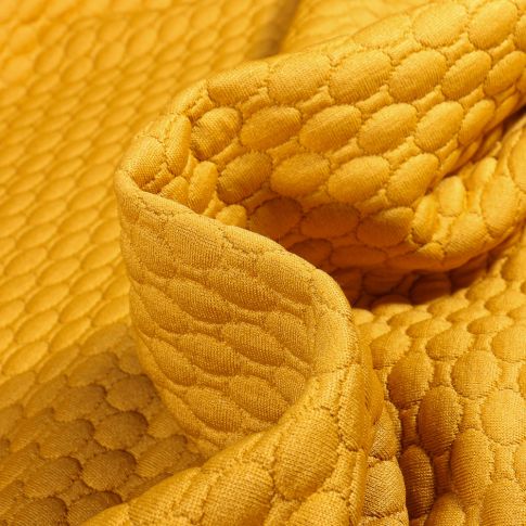 Tissu Sweat matelassé Alvéoles ovales sur fond Jaune