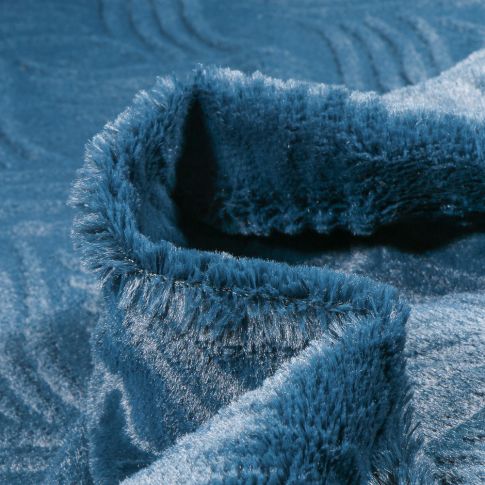 Tissu Fausse fourrure Wavy sur fond Bleu pétrole