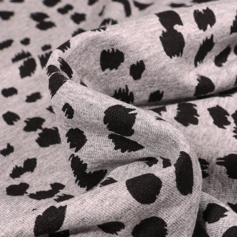 Tissu Jersey Viscose  Taches dalmatiens sur fond Gris chiné