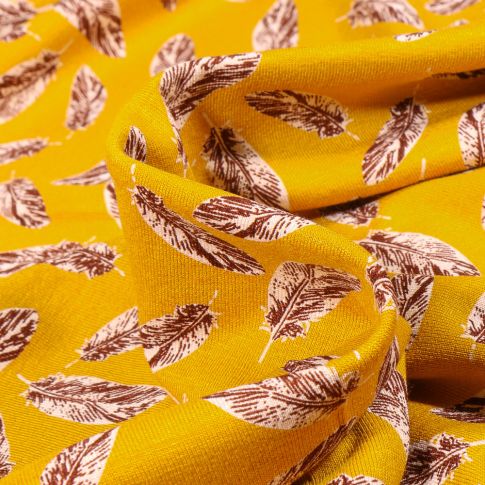 Tissu Jersey Viscose  Plumes sur fond Jaune