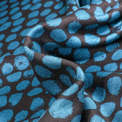 Tissu Maille polyviscose Ronds destructurés bleu sur fond Noir