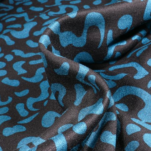 Tissu Maille polyviscose Anna Motifs abstraits bleu sur fond Noir
