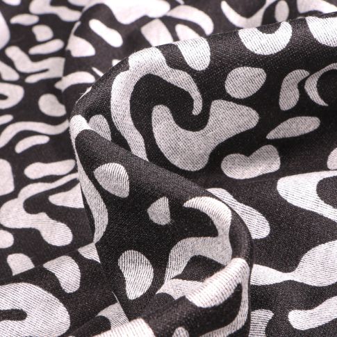 Tissu Maille polyviscose Anna Motifs abstraits gris clair sur fond Noir