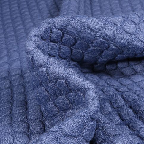 Tissu Sweat matelassé  Alvéoles ovales sur fond Bleu
