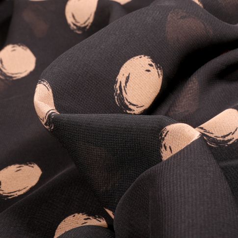 Tissu Mousseline Pois 3 cm beige sur fond Noir