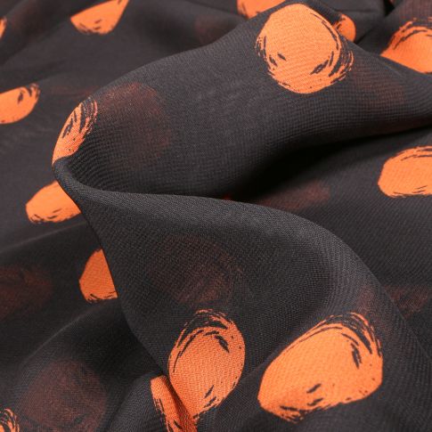 Tissu Mousseline Pois 3 cm orange sur fond Noir
