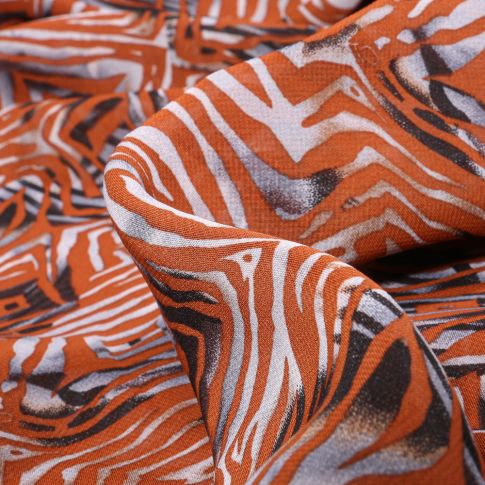 Tissu Mousseline Leila sur fond Orange