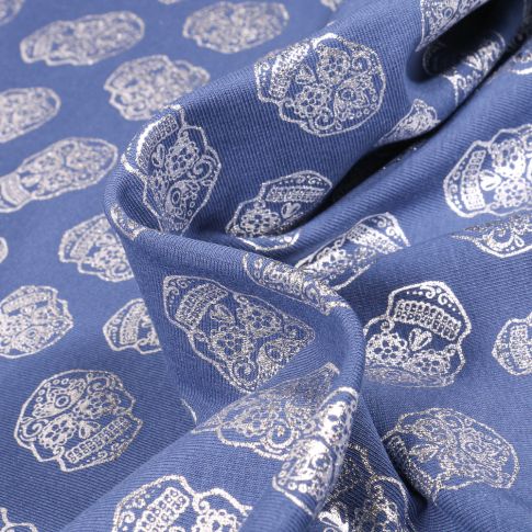 Tissu Jersey Coton Têtes de morts métallisées sur fond Bleu