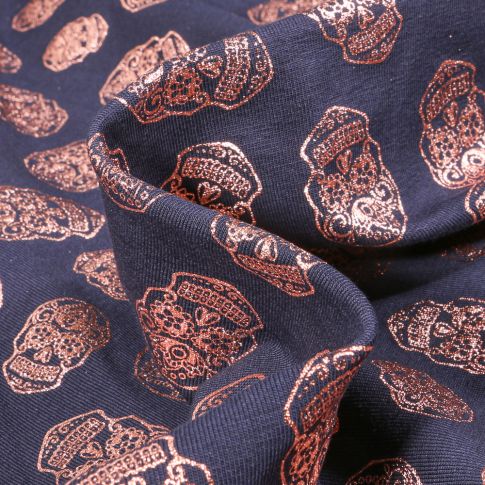 Tissu Jersey Coton Têtes de morts métallisées sur fond Bleu marine