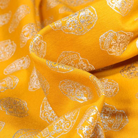Tissu Jersey Coton Têtes de morts métallisées sur fond Jaune