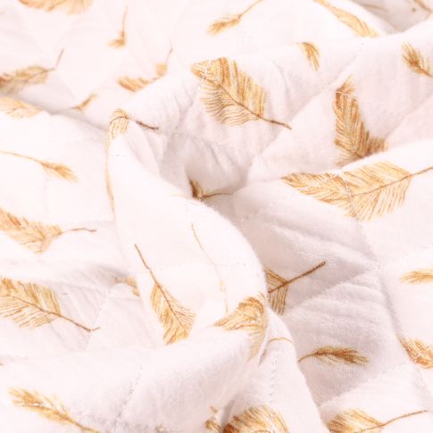 Tissu Double gaze Matelassée Plume ocre sur fond Blanc