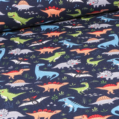 Tissu Jersey Coton Dinosaures multicolores sur fond Bleu marine