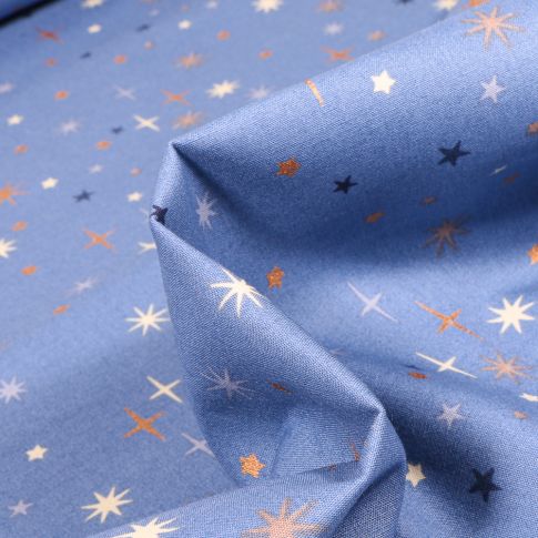 Tissu Coton imprimé Etoiles scintillantes sur fond Bleu