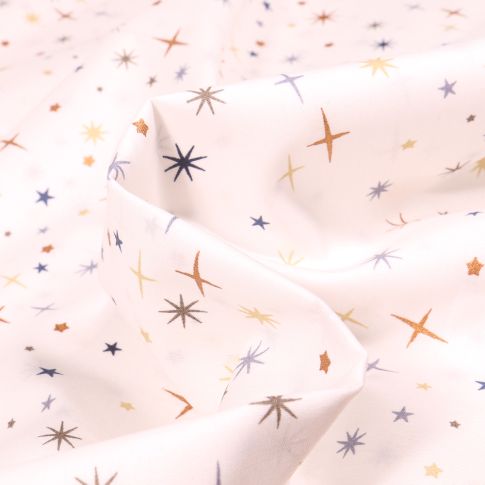 Tissu Coton imprimé Etoiles scintillantes sur fond Blanc cassé