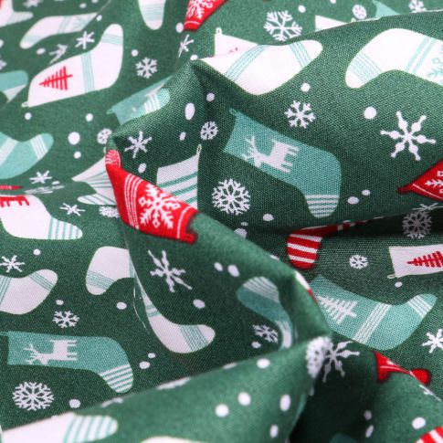 Tissu Coton imprimé Chaussettes du réveillon sur fond Vert