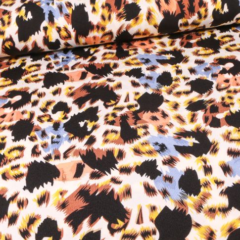 Tissu Jersey crêpe Taches léopard  colorés bleues sur fond Blanc cassé