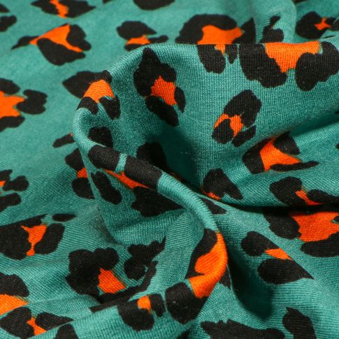 Tissu Jersey Viscose  Léoprint sur fond Vert émeraude