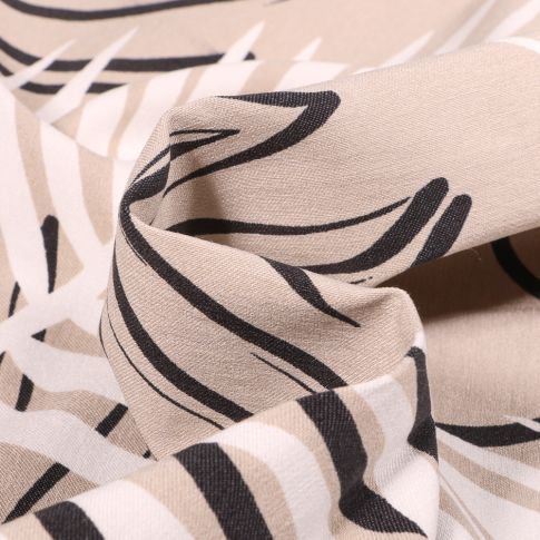 Tissu Bengaline Feuilles noires et blanches sur fond Beige