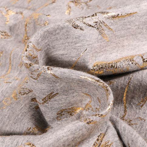 Tissu Jersey Coton Squelettes Dino métallisé sur fond Gris chiné