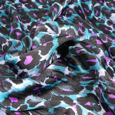 Tissu Mousseline lurex Guépard néon sur fond Bleu turquoise