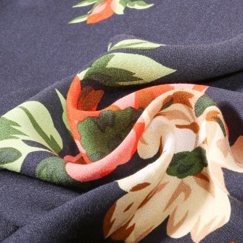 Tissu Crêpe de Viscose Flowers orange sur fond Bleu denim