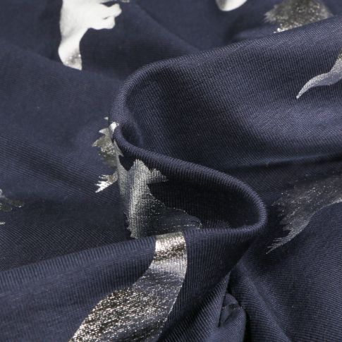 Tissu Jersey Coton Dino métalissé argenté sur fond Bleu marine