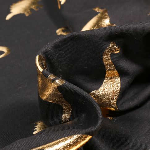 Tissu Jersey Coton Dino métalissé doré sur fond Noir