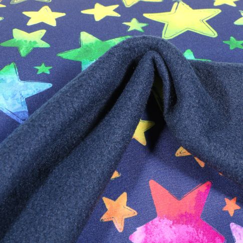 Tissu Softshell Etoiles multicolores sur fond Bleu