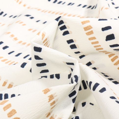 Tissu Crêpe Stretch Mery sur fond Blanc cassé