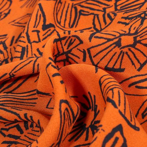 Tissu Crêpe Georgette Makao sur fond Orange