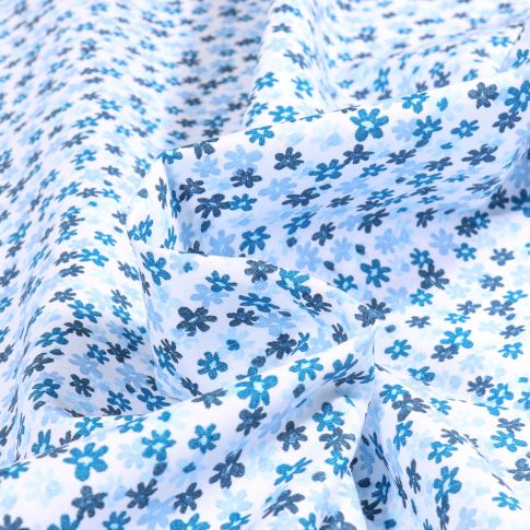 Tissu Coton imprimé Millefleurs bleu sur fond Blanc