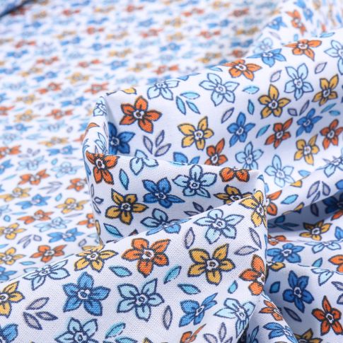 Tissu Coton imprimé Cali bleu sur fond Blanc