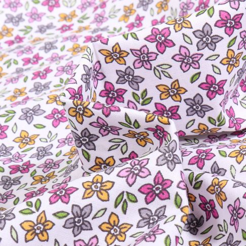 Tissu Coton imprimé Cali rose doux sur fond Blanc
