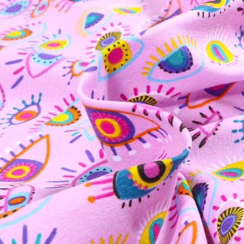 Tissu Coton imprimé Eyes color sur fond Rose