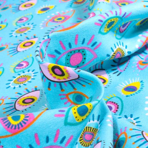 Tissu Coton imprimé Eyes color sur fond Bleu turquoise