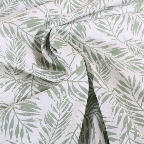 Tissu Popeline de Coton Feuillage vert amande sur fond Blanc cassé