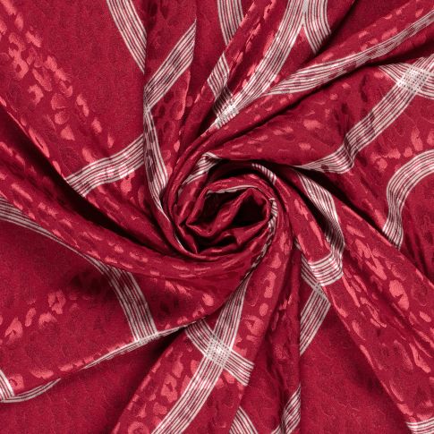 Tissu Satin imprimé Relief léopard sur fond Rouge
