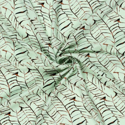 Tissu Popeline de Viscose imprimé Feuilles noires sur fond Vert menthe clair