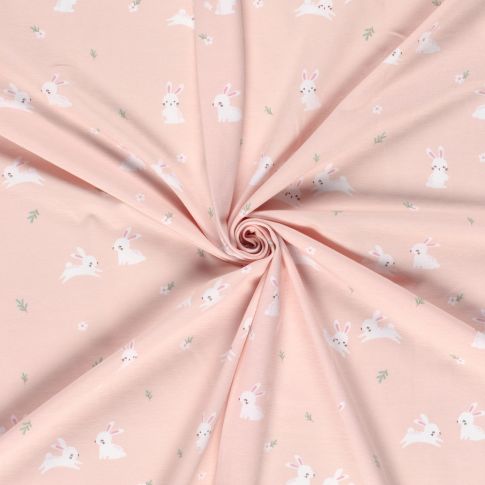 Tissu Jersey Coton Lapins blancs sur fond Rose pâle